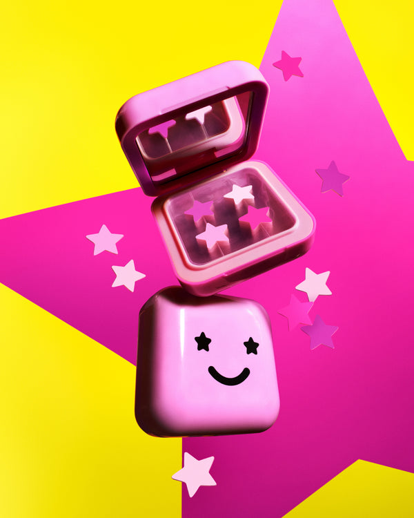Open Starface pink compact showing pink Hydro-Star® pimple patches and a mirror. Refillable star-shaped patches.