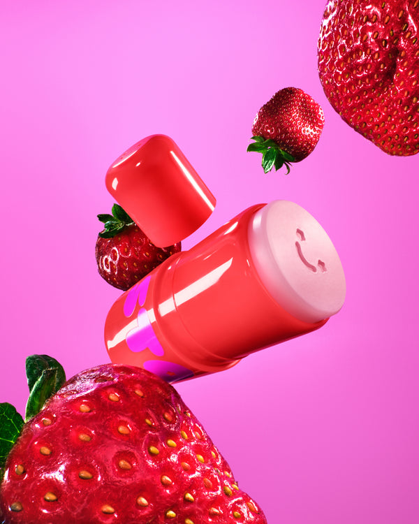 Starface Star Balm® So Strawberry lip balm uncapped. Shea butter, cocoa butter and coconut oil hydrate lips.